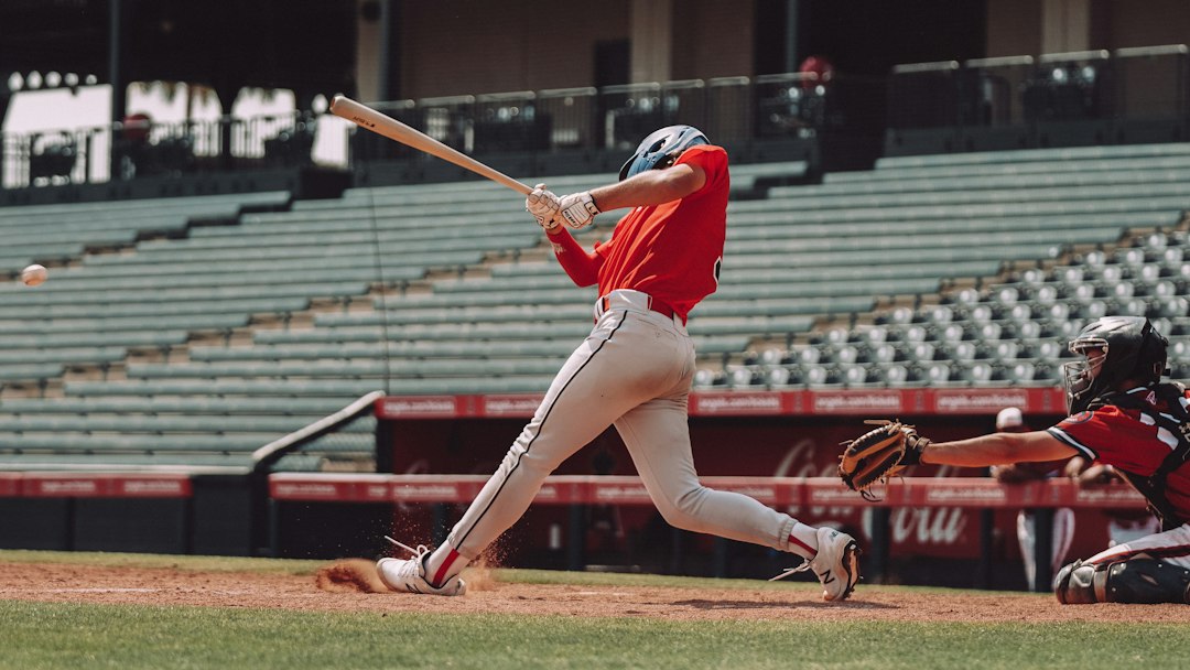 Baseball player swinging at a pitch