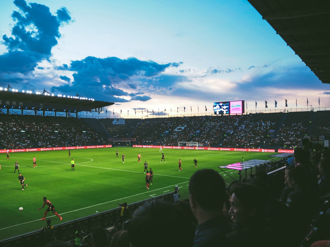 Crowd watching a football match in a packed stadium during a European matchday