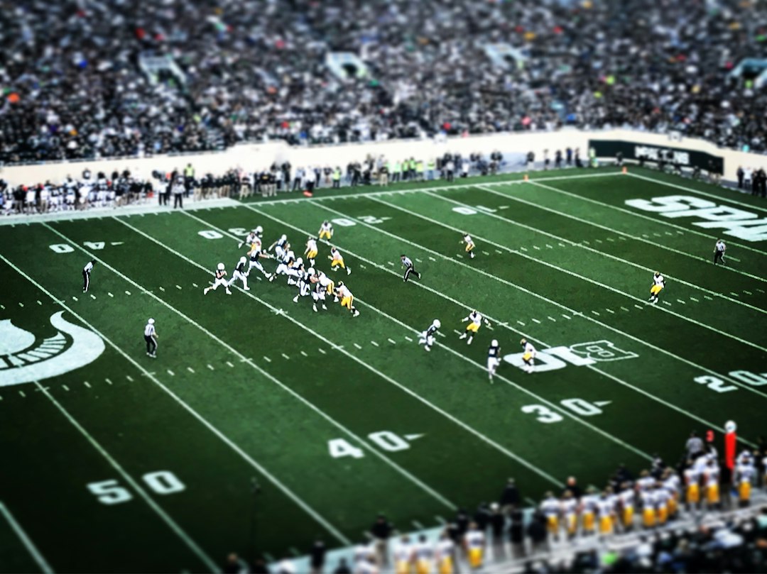 American football game under stadium lights
