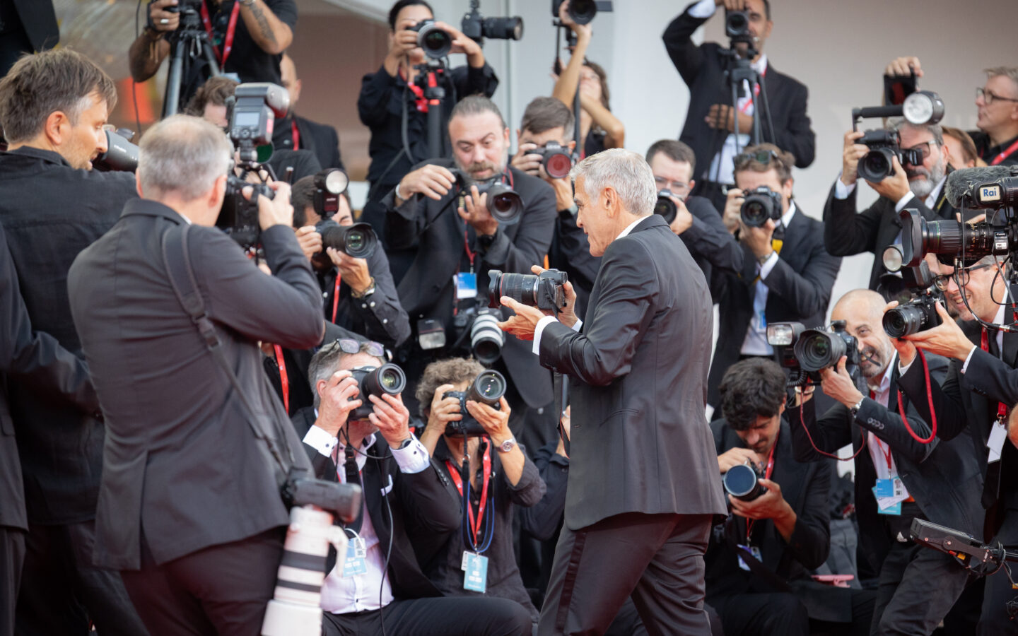 Photographers and guests on the red carpet at the Venice Film Festival