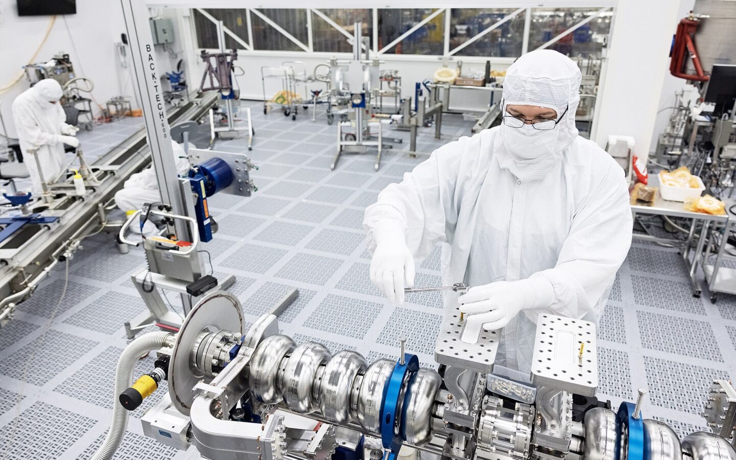 Technician working inside a semiconductor clean room