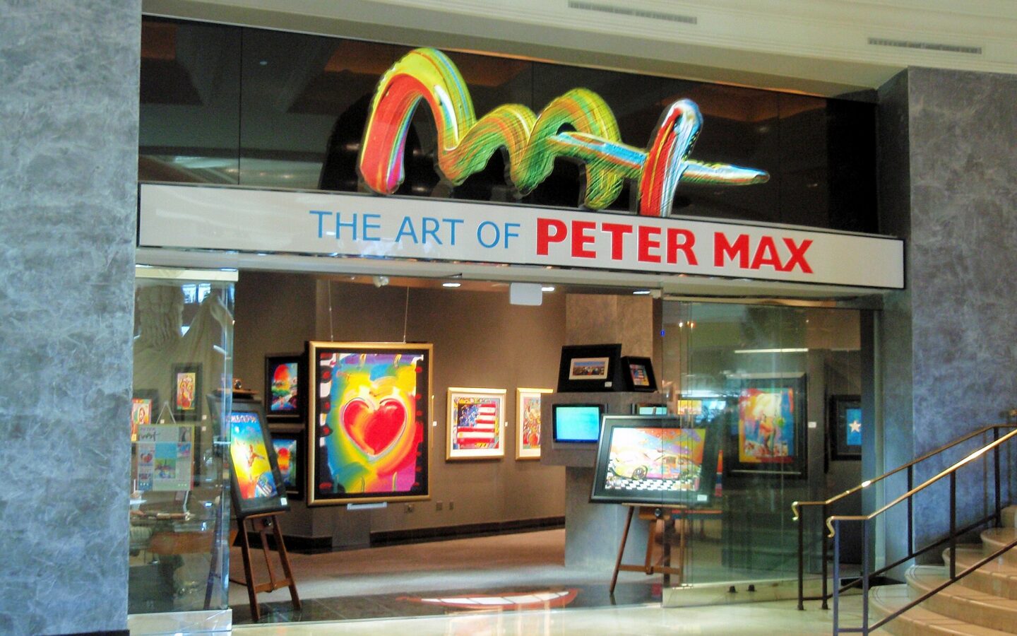 Gallery display featuring the colorful artwork of Peter Max